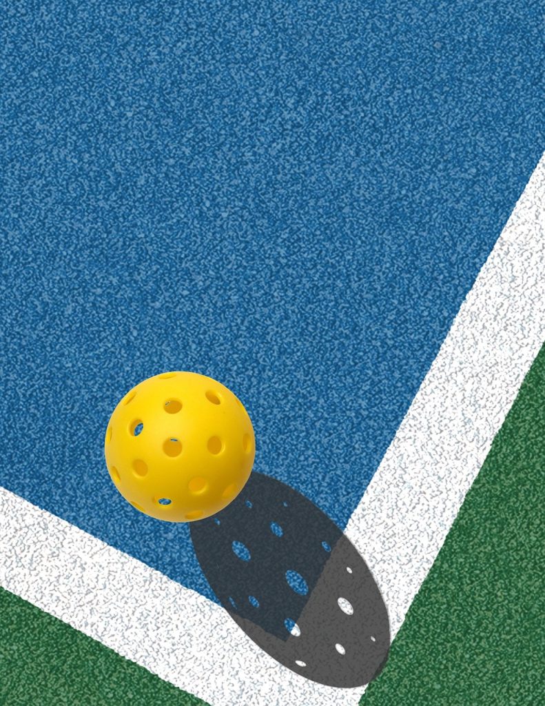 Pickleball ball on court